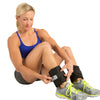 Female putting on Adjustable Ankle Weights