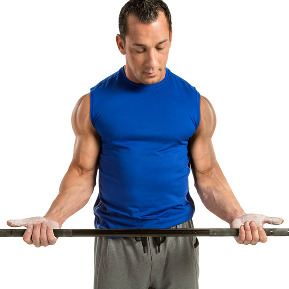 Male holding weight bar with liquid chalk on hands