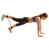 Female using Resist-a-Cuffs while performing plank with single leg raise