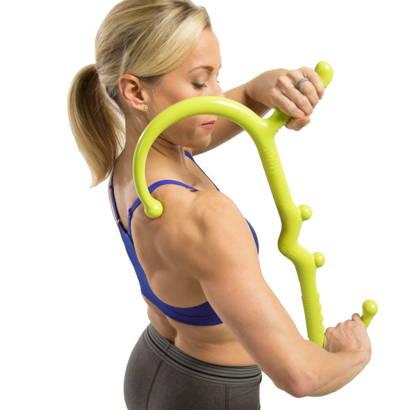 Female utilizing Muscle Hook on upper back