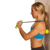 Female rolling mid back against wall w/ GoBall - Targeted Massage Ball