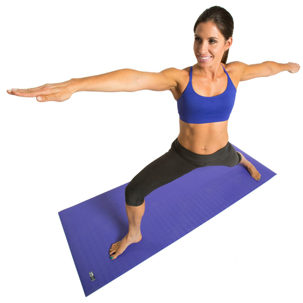 Female performing warrior 2 on Summit Workout Mat